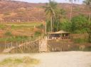 Beach_shack_on_river_at_Mandrem.JPG